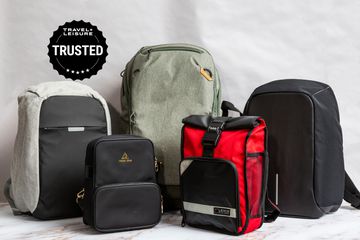 A selection of anti-theft backpacks in front of a white background