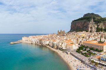 Panorama of the Celafu medieval old town and beach in Sicily, Italy