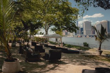 Loungers looking at the nyc skyline at GITANO Island