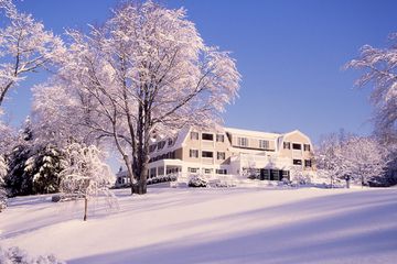 Exterior of Mayflower Inn & Spa, Auberge Resorts Collection in the wintertime