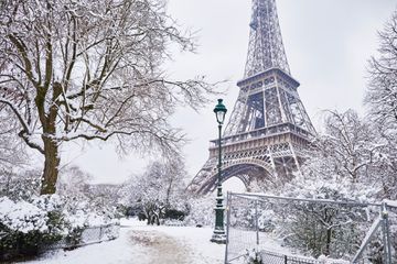 Scenic view to the Eiffel tower on a day with heavy snow.
