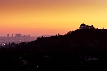 Westside of Los Angeles Behind Griffith Observatory at Dusk - Drone Shot