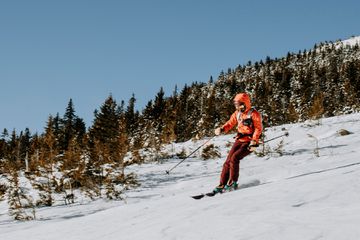 person skiing down Baldface Mountain