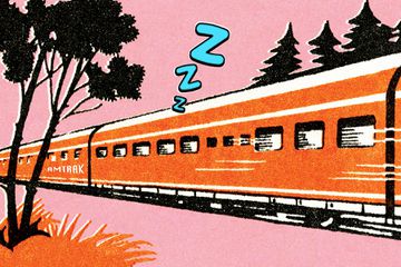 An illustration of an orange train with cartoon "Z's" coming out, signifying someone is sleeping 