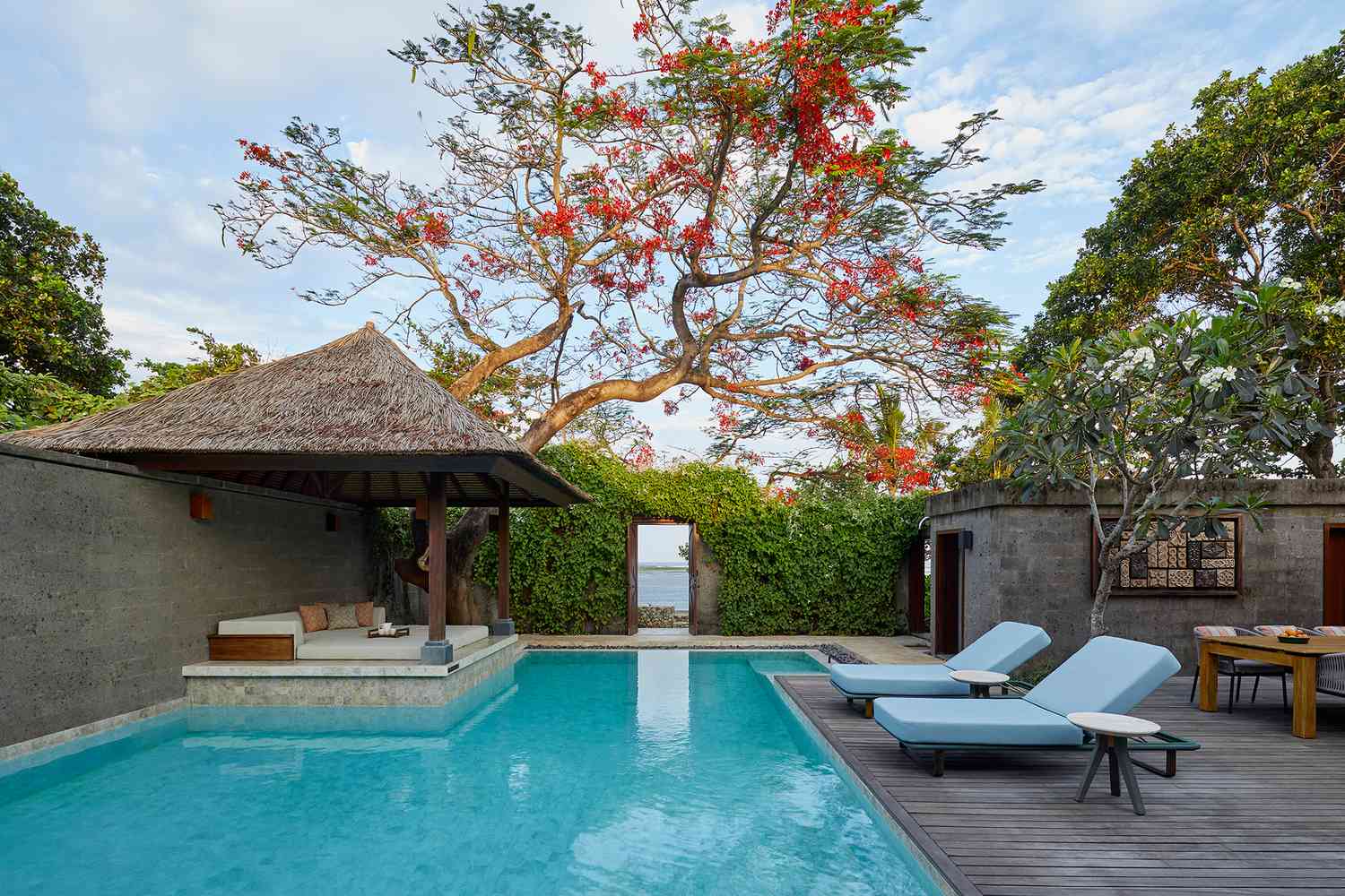 Swimming pool with outdoor seating at Andaz Bali