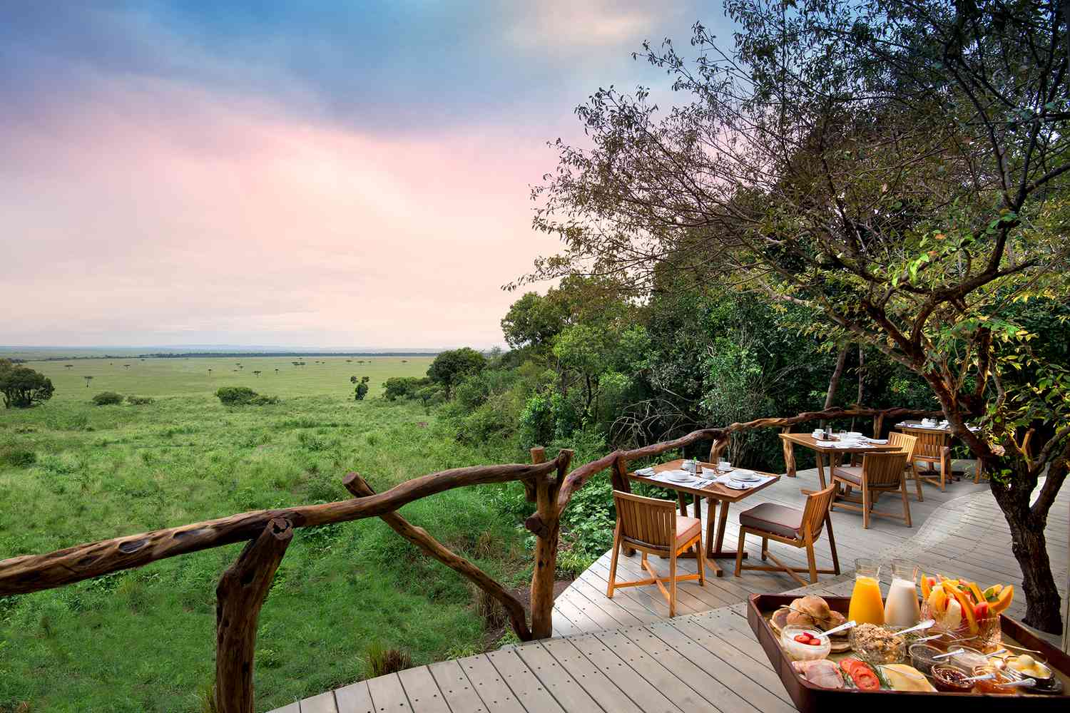 Outdoor dining with view of landscape at andbeyond Bateleur