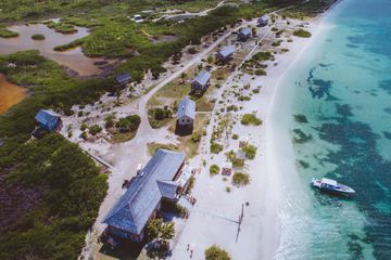 A beach resort next to the ocean in Barbuda