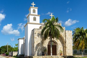 Capilla Santa Cruz Catholic Church Building Exterior on Waterfront. Small stone Catholic church, Cozumel, Mexico.