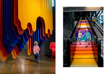 Children play in a multicolored museum exhibit