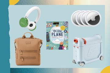 Kid's headphones, airplane activity book, Apple Airtags, a kids suitcase and diaper bag