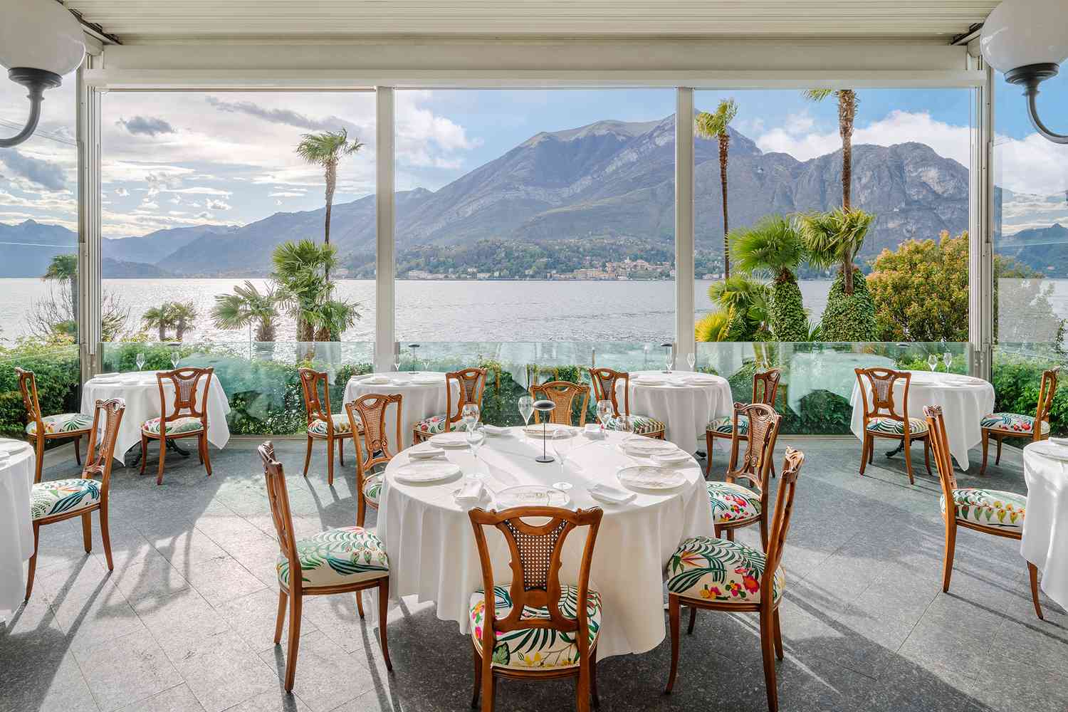 Dining with view of mountains and water at Grand Hotel Villa Serbelloni