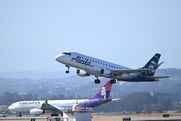 Alaska and Hawaiian Airlines planes takeoff at the same time from San Francisco International Airport (SFO) in San Francisco, California,