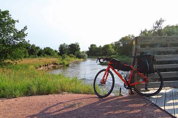 A bike resting on a bench on the Cowboy Recreation and Nature Trail in Nebraska