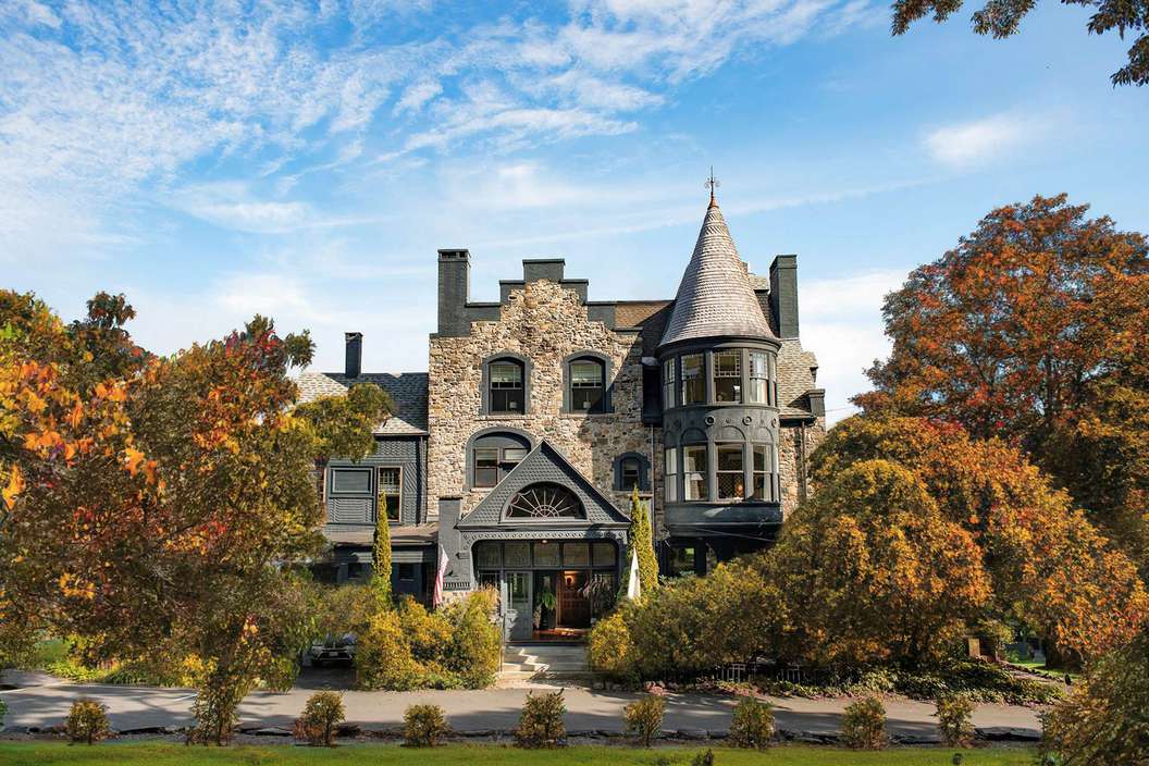The exterior of Norumbega Inn in Maine during the fall 
