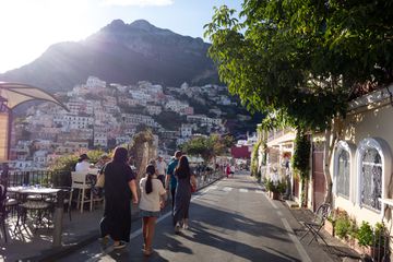 Tourist walking down the street in Positano, Italy on the Amalfi Coast 