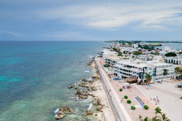 Aerial view of buildings along the coast of Isla Mujeres
