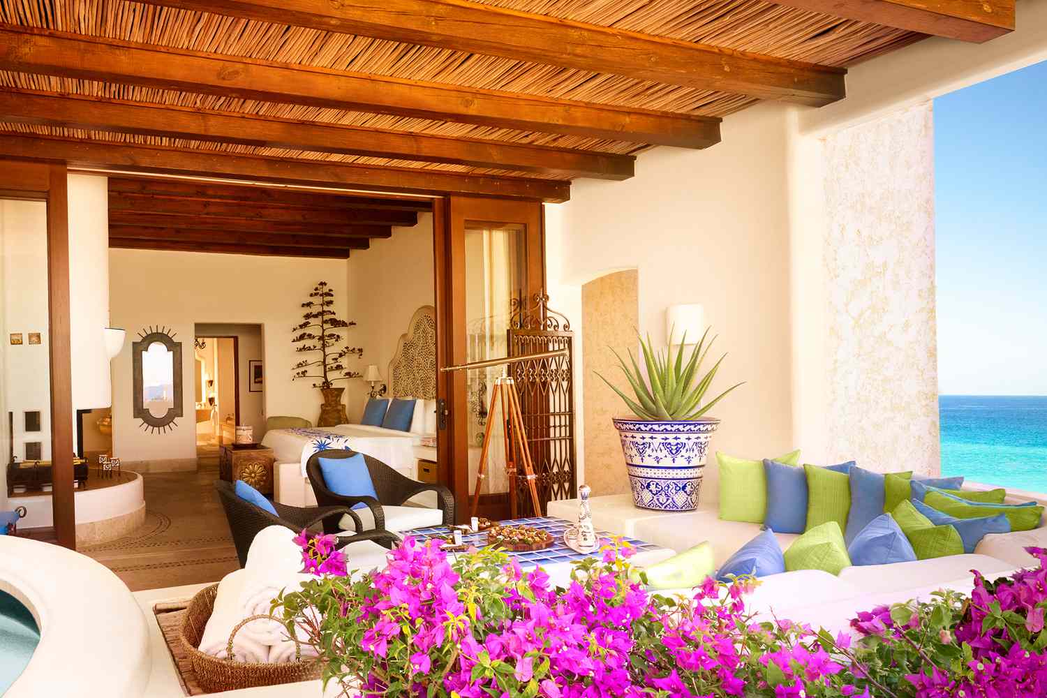 Suite with flowers on terrace at Las Ventanas al Paraiso, a Rosewood Resort