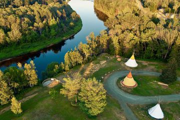 A aeriel view of Metepenagiag Heritage Park including traditional teepee houses