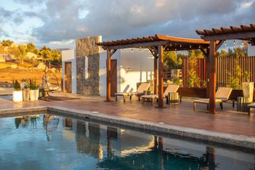 Pool and cabanas in the golden hour light