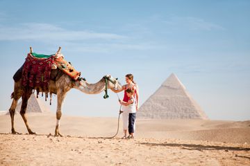 Mother and son with a camel 