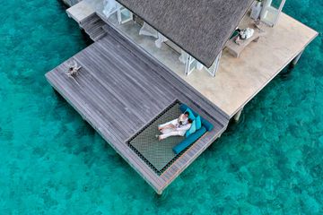 Couple relaxing during their elopement in the Maldives