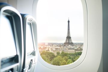 The Eiffel Tower seen through an airplane window 
