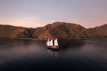 A sailboat on the water in the Komodo islands